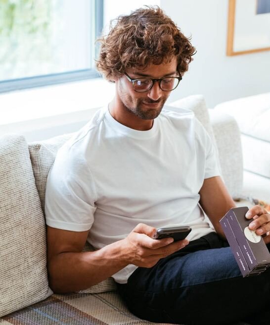 A man in glasses ordering new contact lenses