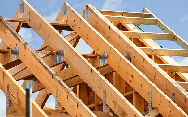 A section of an engineered wood roof truss.