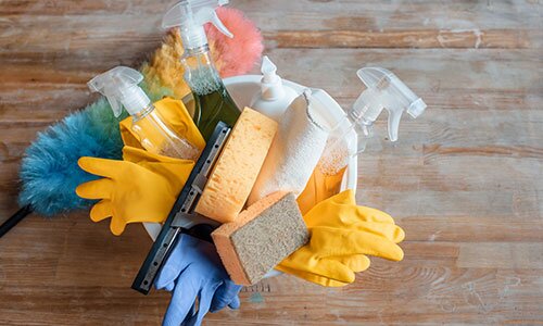 Cleaning supplies are on a table.