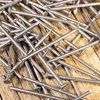 A close up of a pile of nails.