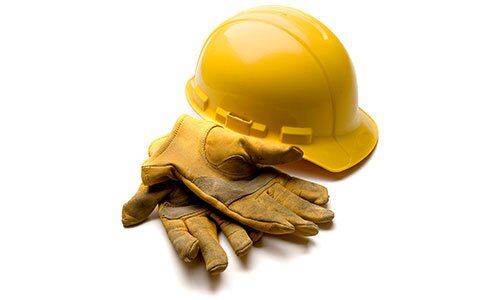 A yellow hard hat and work gloves, no background.