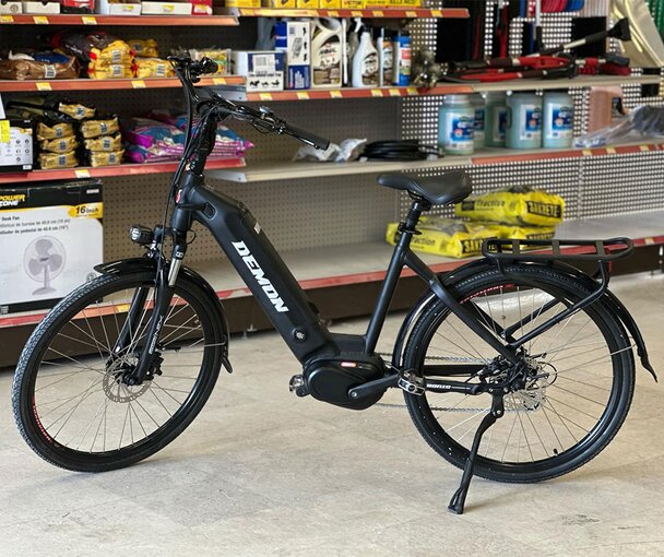 A Demon Powersports Electric Bike is displayed at Got Wood Building Supplies.
