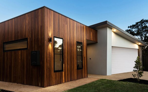 A small home with red cedar siding of small.