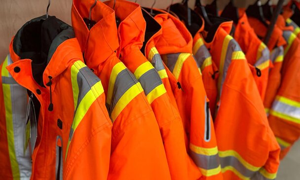 PPE High-Vis jackets hanging in the store at Got Wood Building Supplies.