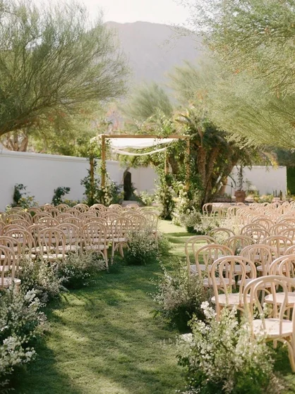 Outdoor wedding aisle with floral decor