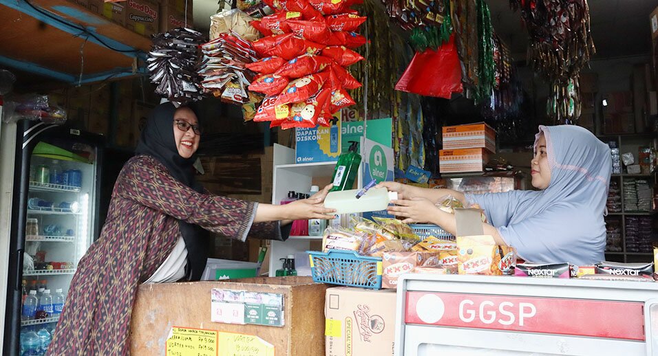 Women conduct business in a market.