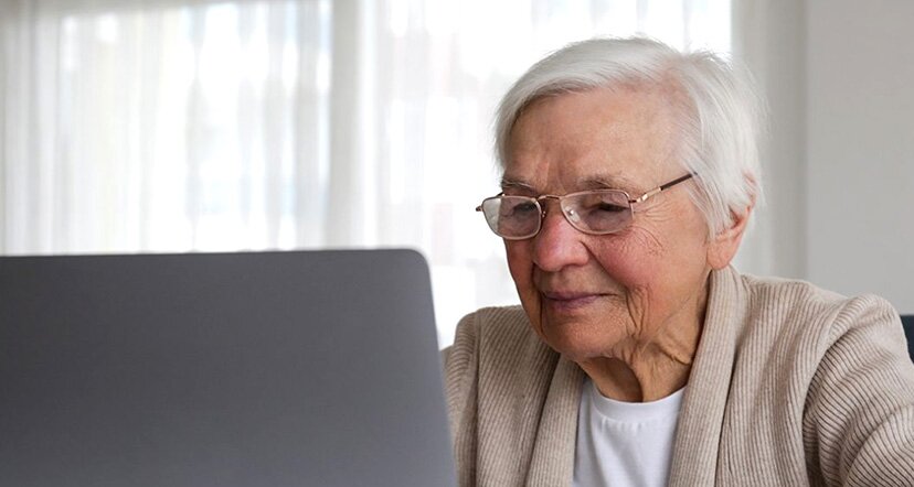 older woman looking at computer screen