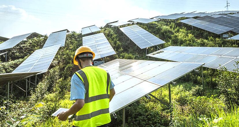 man working on solar panels