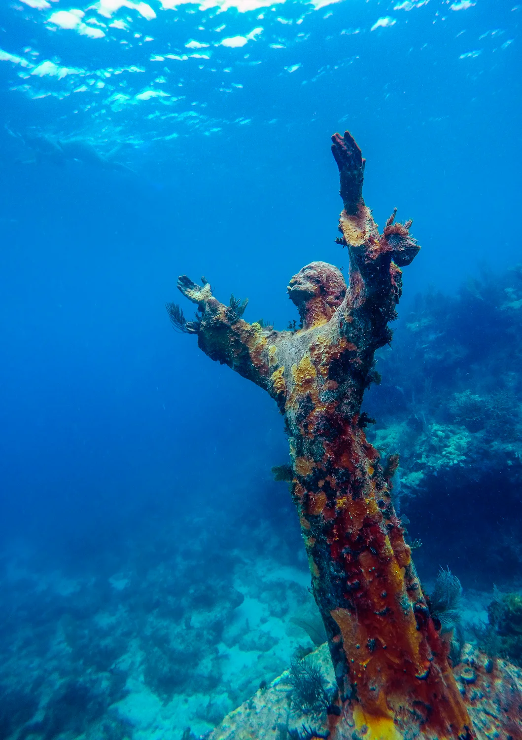Christ of the Abyss bronze statue underwater in Key Largo Florida Keys snorkeling tour