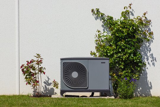 Heat pump in a wall with brush around it