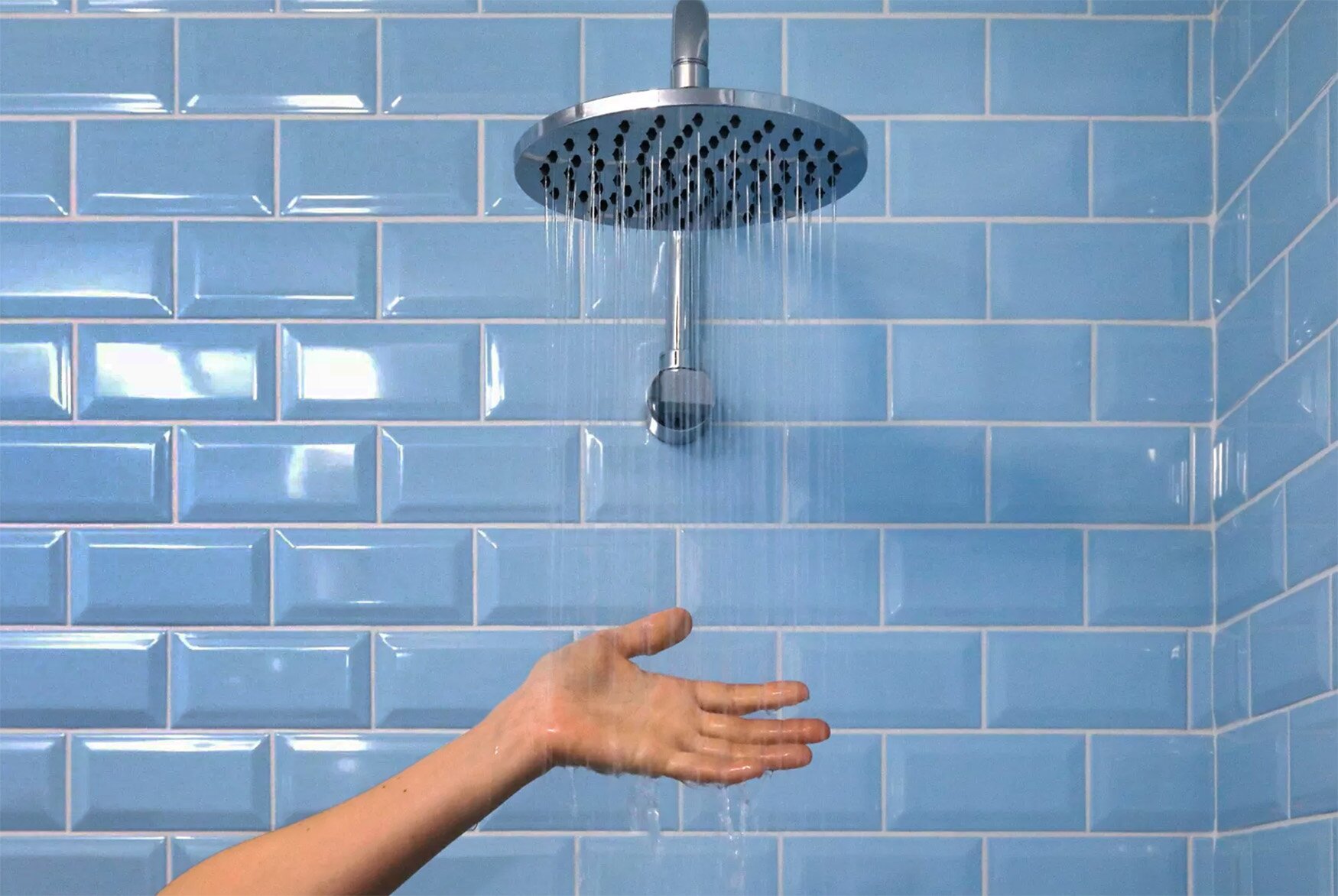 Homeowner checking shower tempature