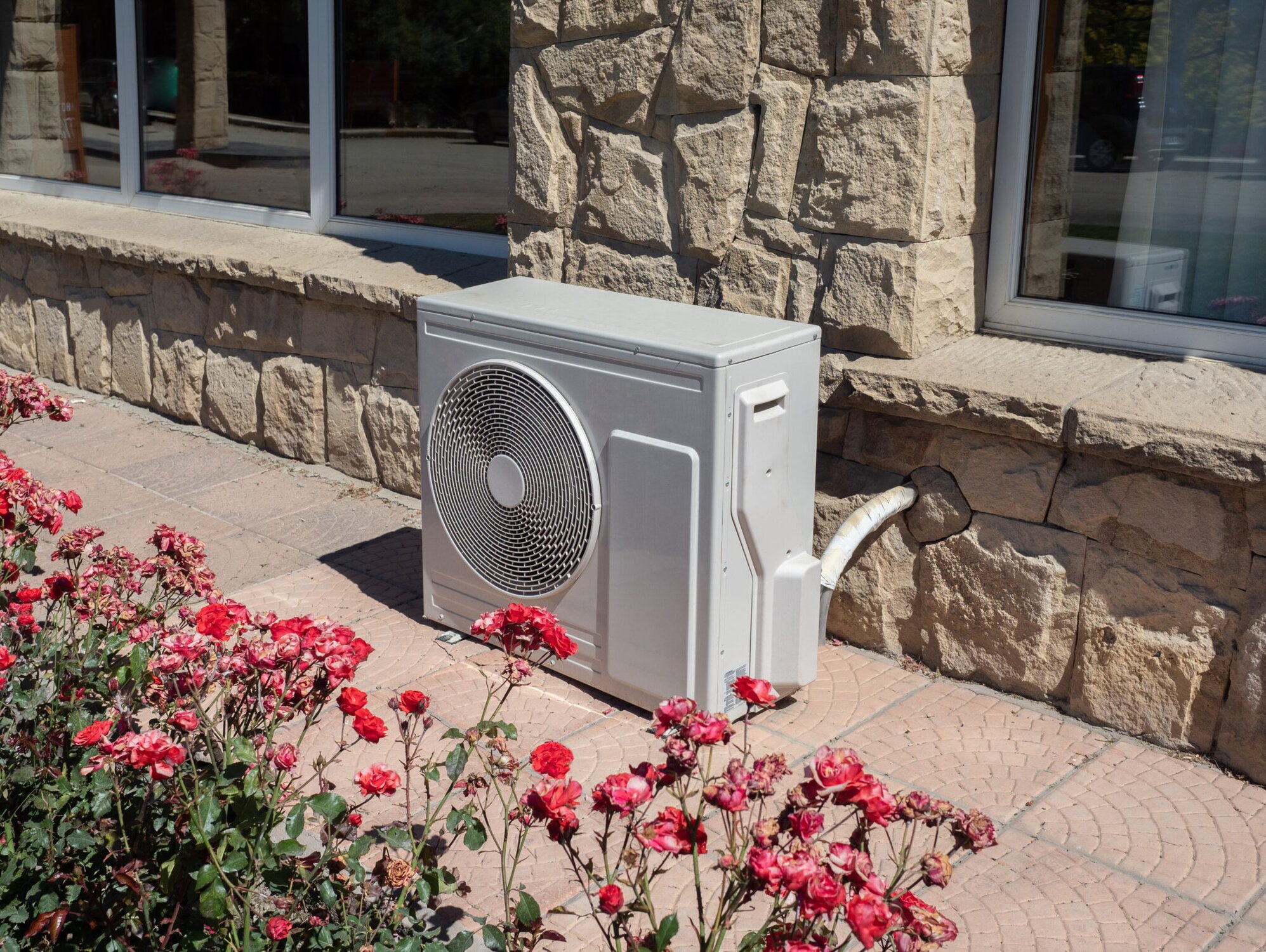 Heat pump near garden and home
