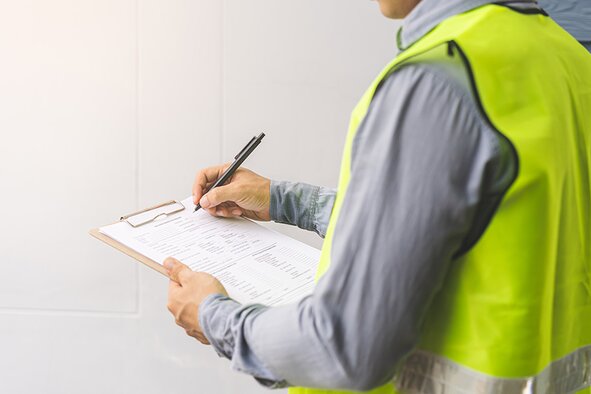 Contractor using clipboard