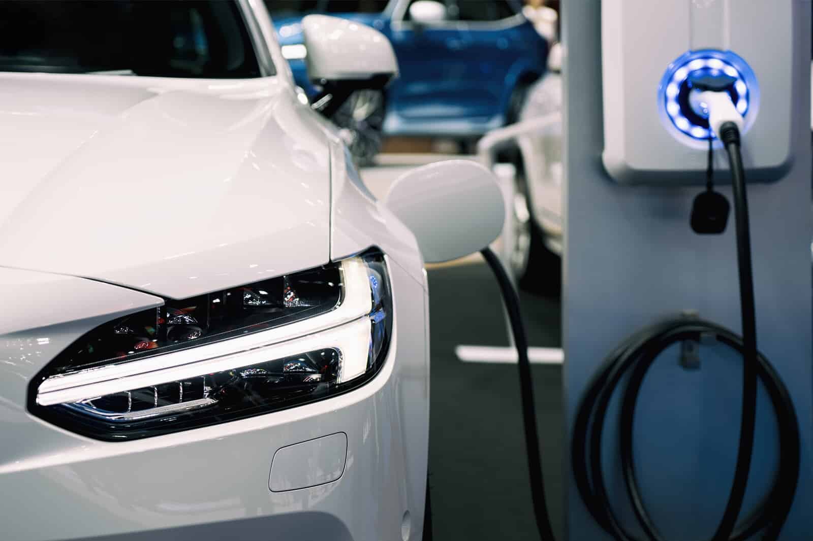 Electric vehicle charger plugged to side of vehicle