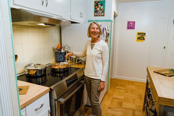 Woman using induction cooking at home.