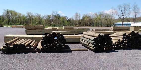 Poles for building or electric service, cross ties, and landscape timber piles at HomeTown Solutions.