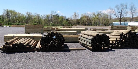 Poles for building or electric service, cross ties, and landscape timber piles at HomeTown Solutions.