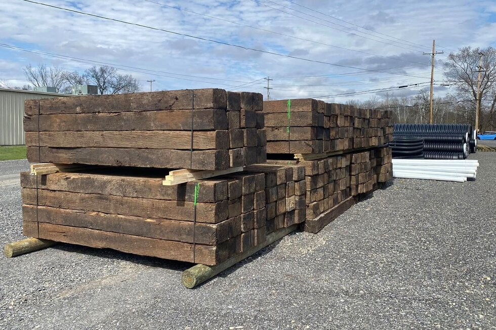 Lumber yard with railroad ties HomeTown Solutions.