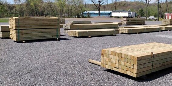 HomeTown Solution's lumber yard with piles of lumber.