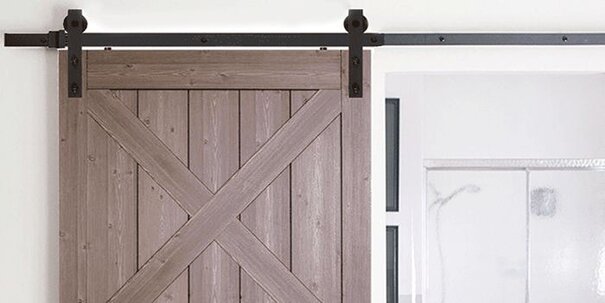 The upper half a of sliding barn door, black hardware.