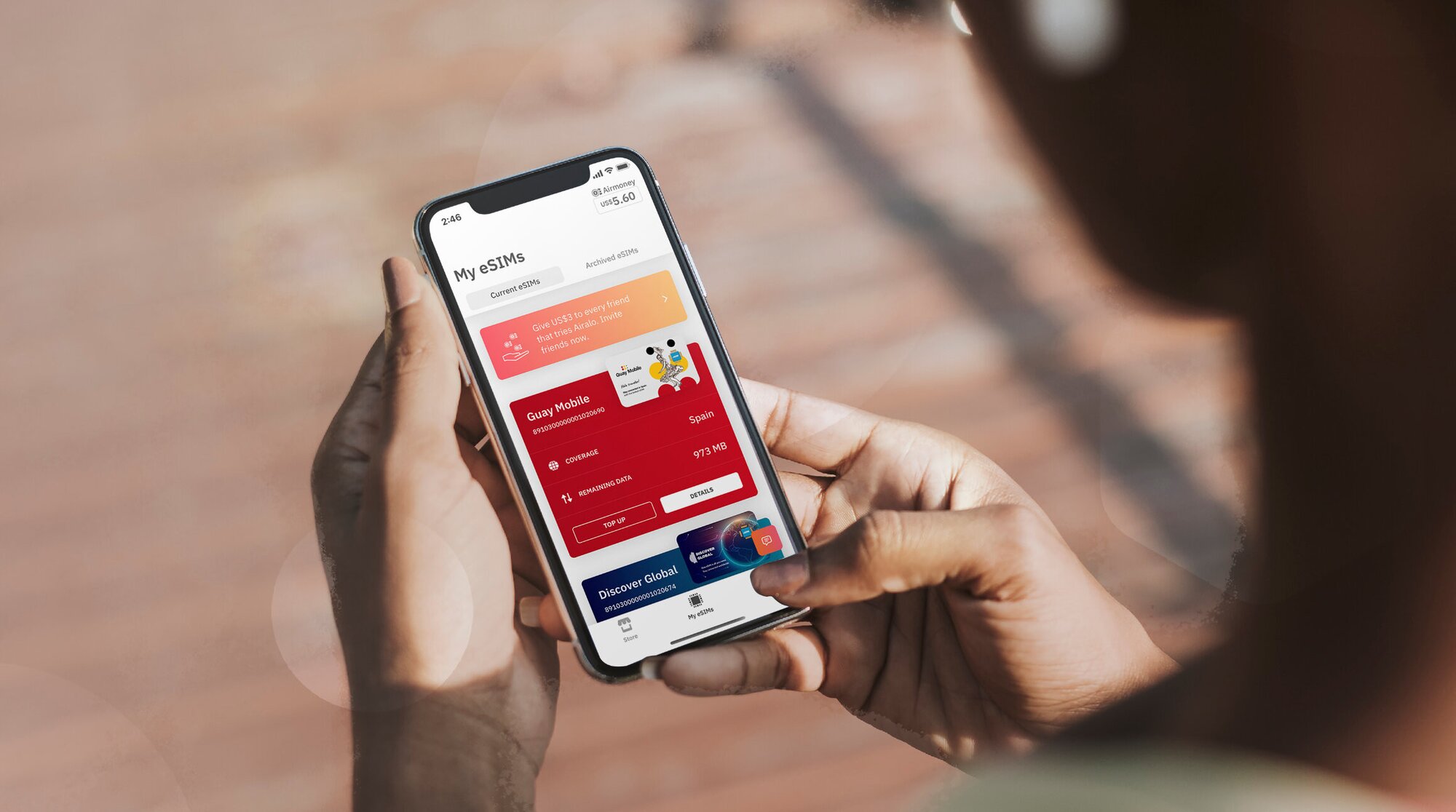 traveler looking at esims on airalo app