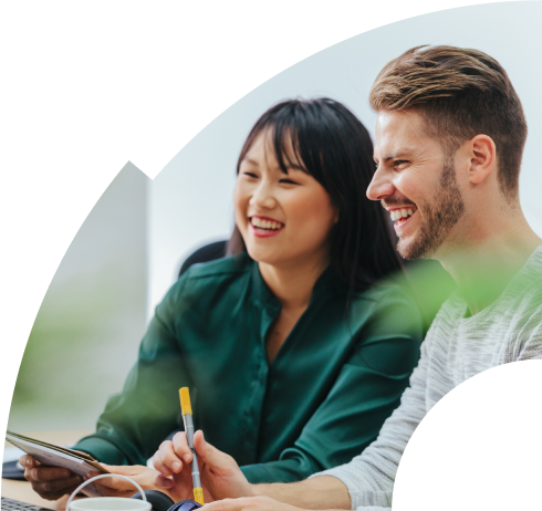 Happy people working together in front of computer
