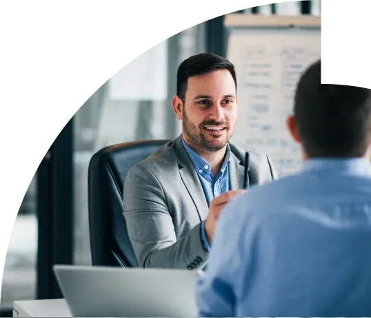 Two men talking in an office