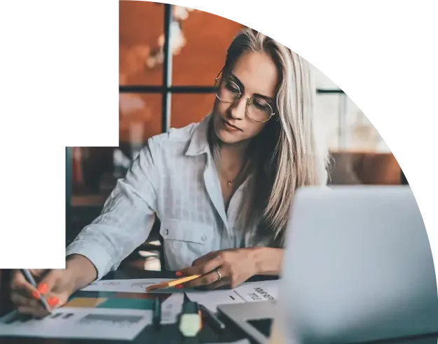 Woman in glasses taking notes