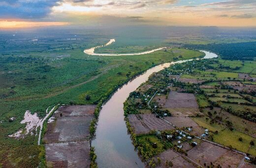 Aerial photo of farm land and a river.