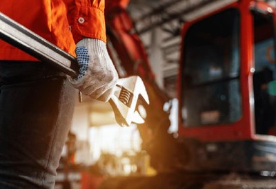 Close-up of a person holding a wrench