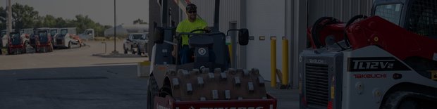 An operator using a compaction roller