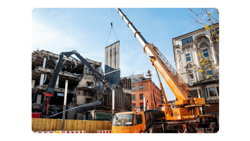 A crane working on a large demolition site