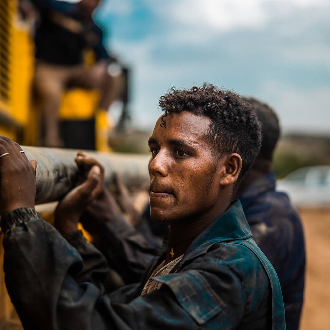 Men building a water point