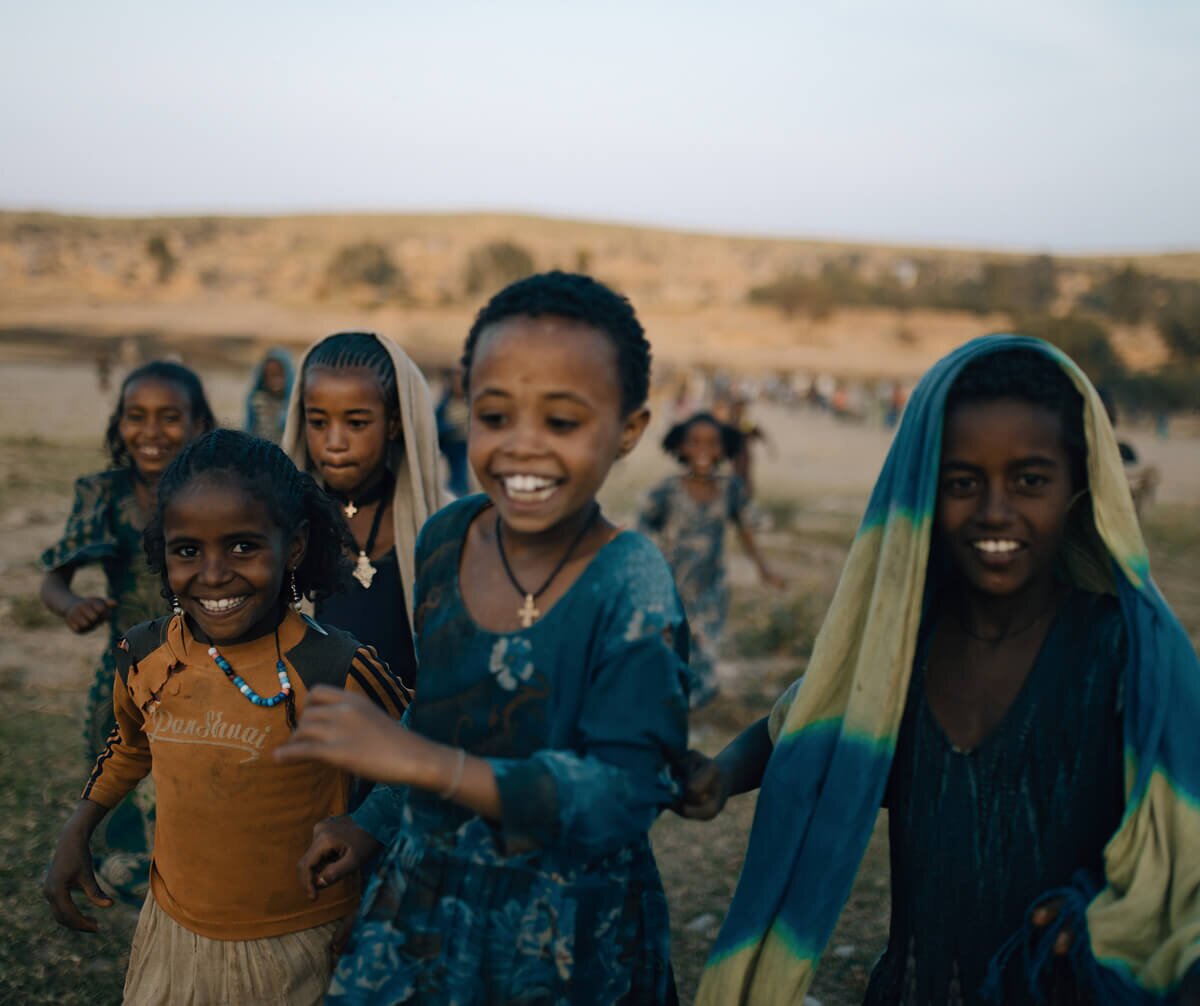 African girls running and smiling
