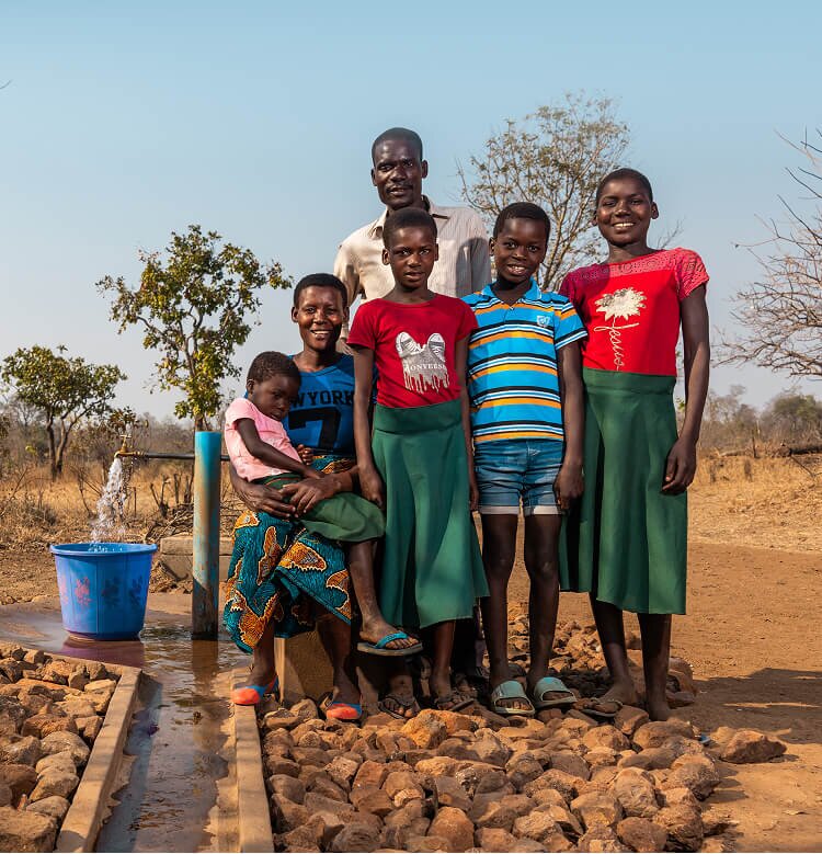 African family at a water tap