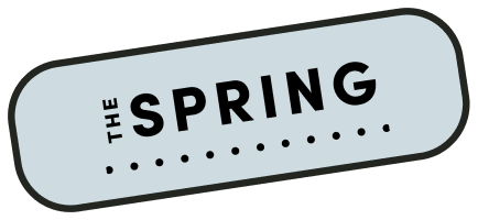 An illustration depicting a badge with text that says "the spring".