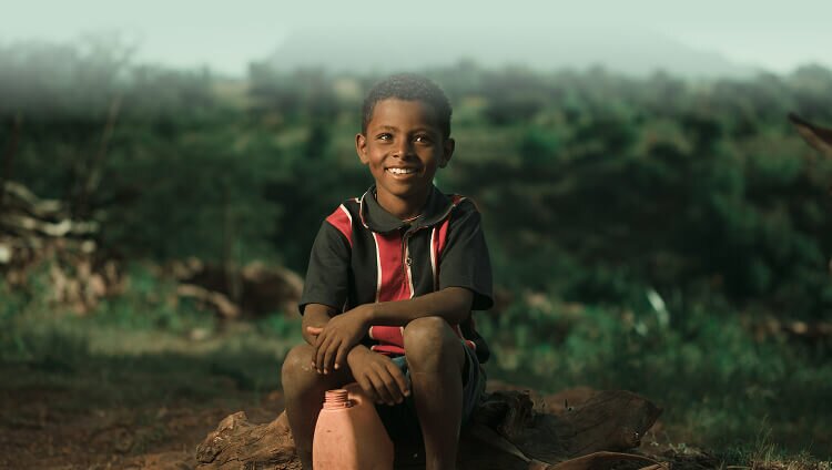 African boy with a jerry can