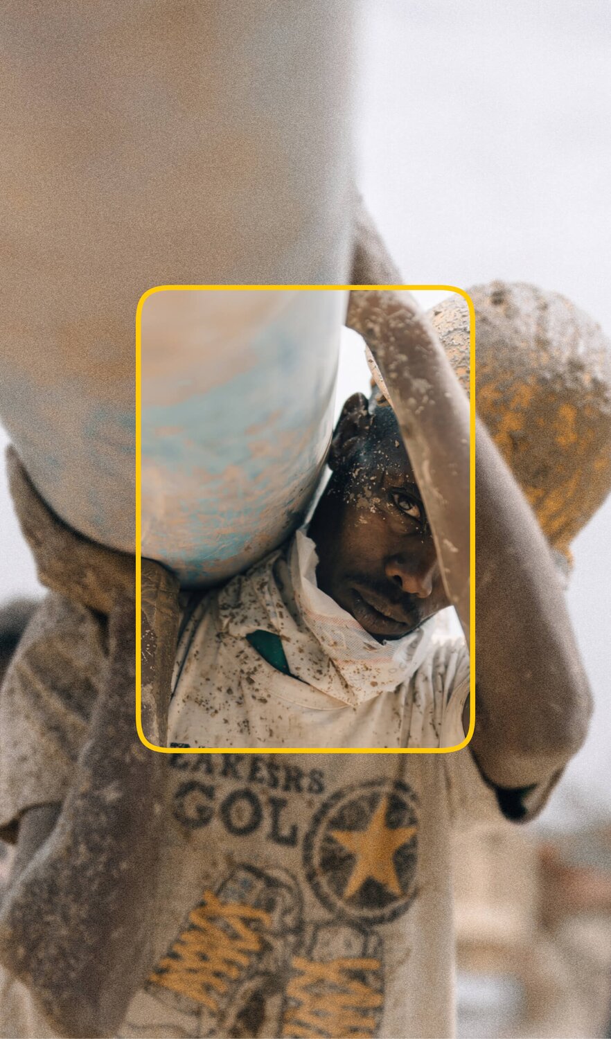 African boy carrying a water pipe