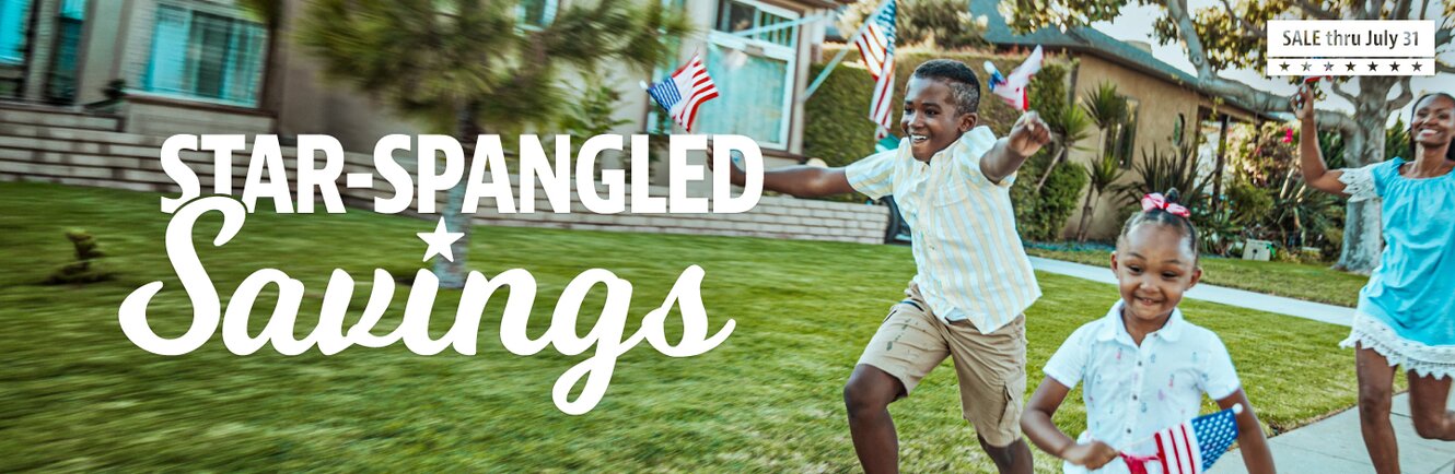 Star-spangled savings. Young family running down sidewalk with American flags in hand. 