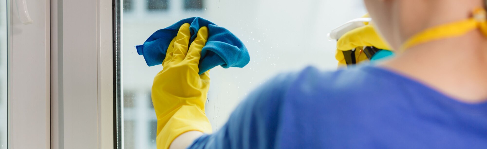 Person cleaning a window