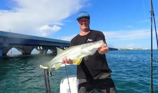 Close-up of an angler holding a snook