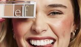 Woman holding affordable Bite Site eyeshadow palette
