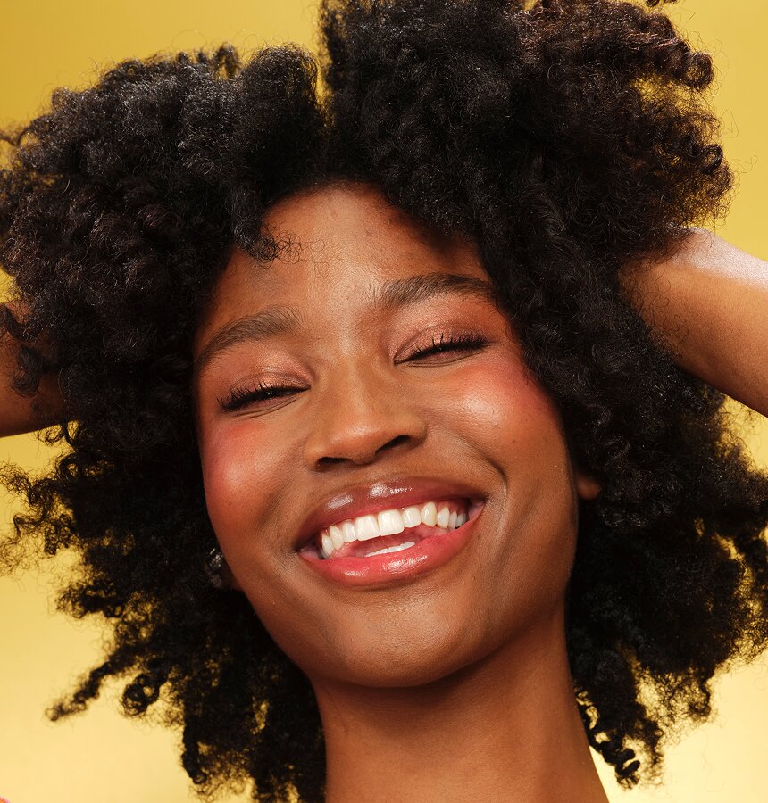 Model wearing e.l.f. Gloss Mode Treatment Oil