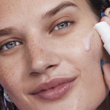 Model Applying Niacinamide Serum