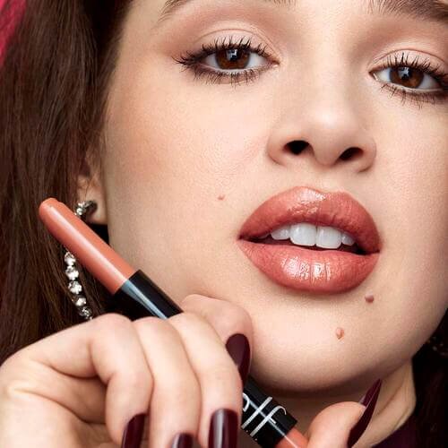 Woman Holding Nude Lip Balm