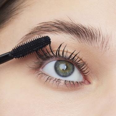 Model Applying Volumizing Mascara