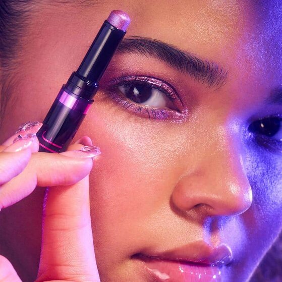 Model Applying Shimmer Eyeshadow Stick