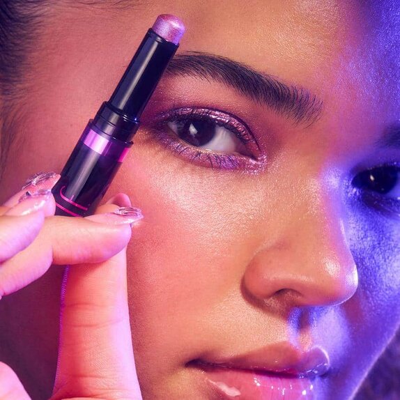 Model Applying Shimmer Eyeshadow Stick