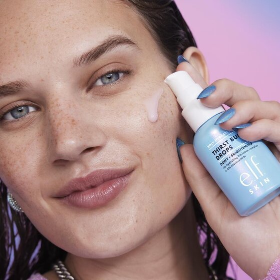 Model Applying Shimmer Eyeshadow Stick