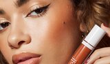 Model Applying Skin Tint